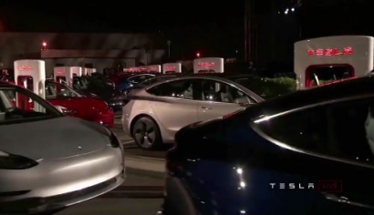 Tesla delivers first of its lower-cost Model 3 cars